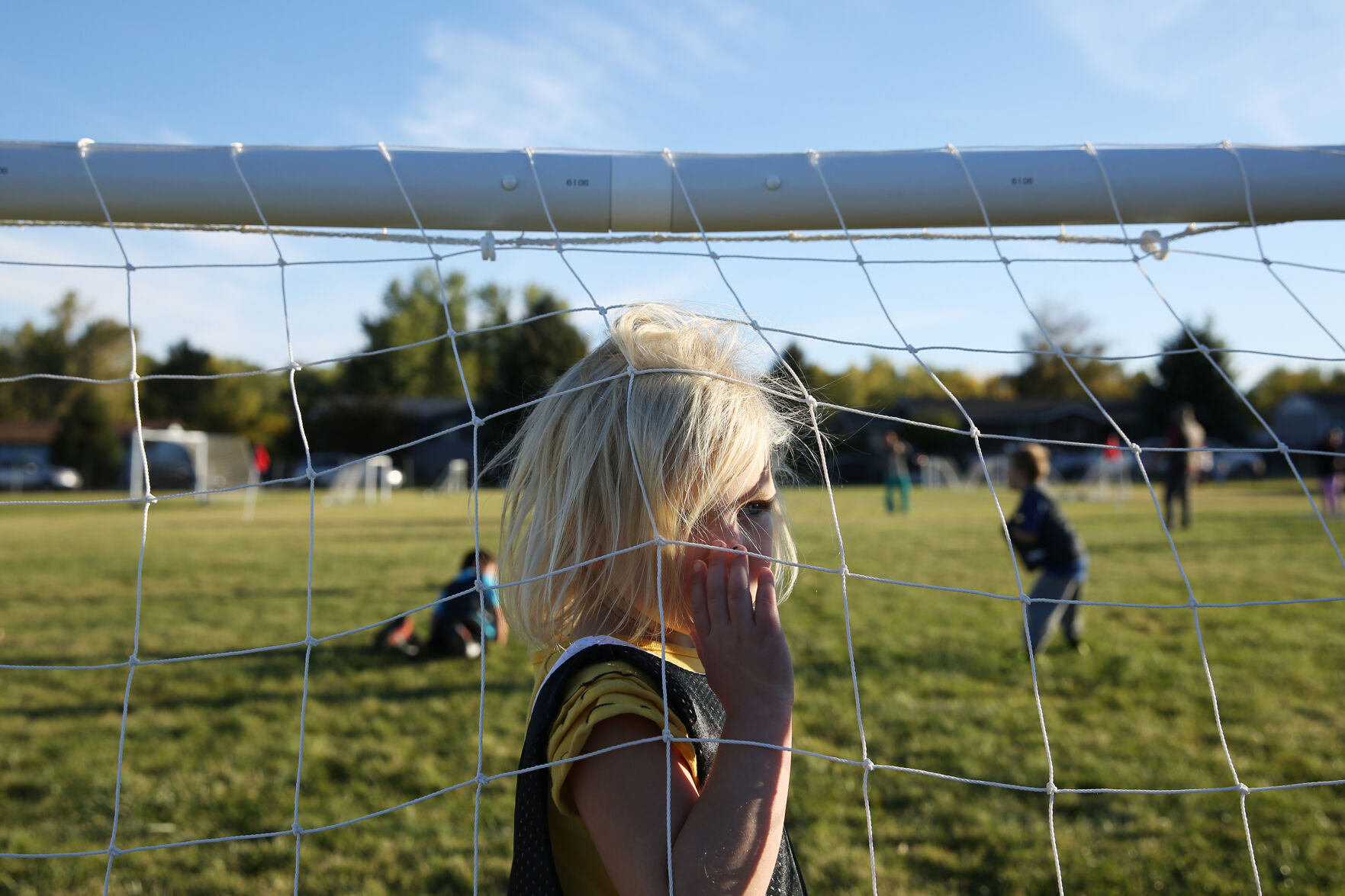 Brinley Howe watches the older kids play a game